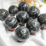 1Pc 0.44-1.1LB Large Astrophyllite Garnet Sphere With Wood Based Stand Crystal Quartz Collection Black Firework Reiki