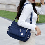 Women nylon waterproof messenger handbag with large capacity, casual design, and shoulder strap, ideal for travel and daily use.