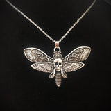 Silver gothic death moth necklace pendant on 18-inch chain, featuring sugar skull and butterfly design, jewelry by HSF Marketplace.