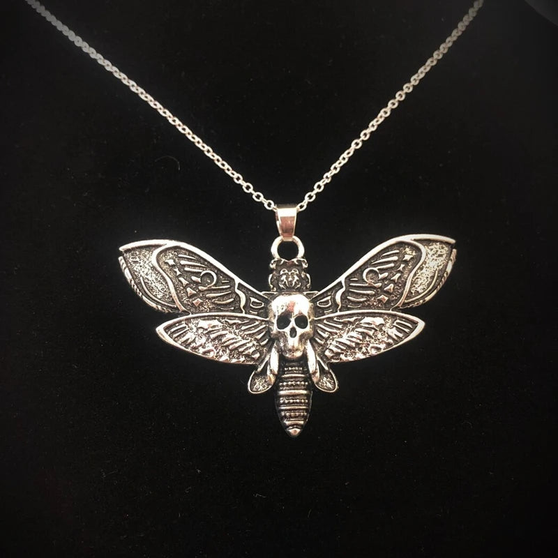 Silver gothic death moth necklace pendant on 18-inch chain, featuring sugar skull and butterfly design, jewelry by HSF Marketplace.