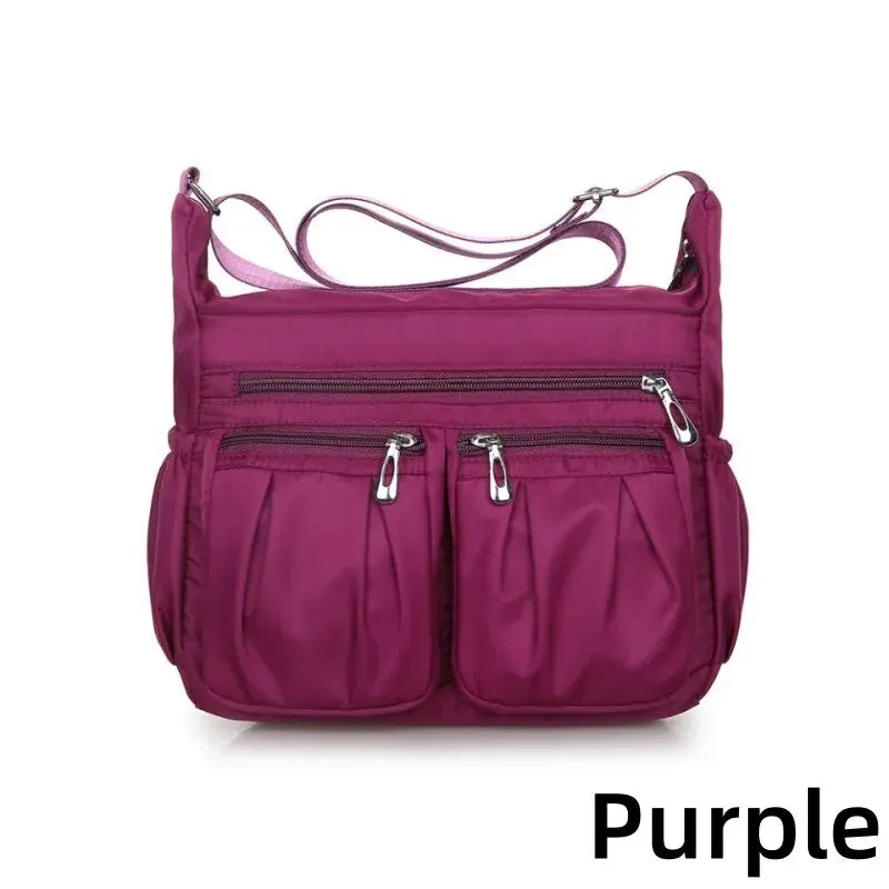 Women nylon waterproof messenger handbag by HSF Marketplace, large capacity crossbody bag for travel and casual use.