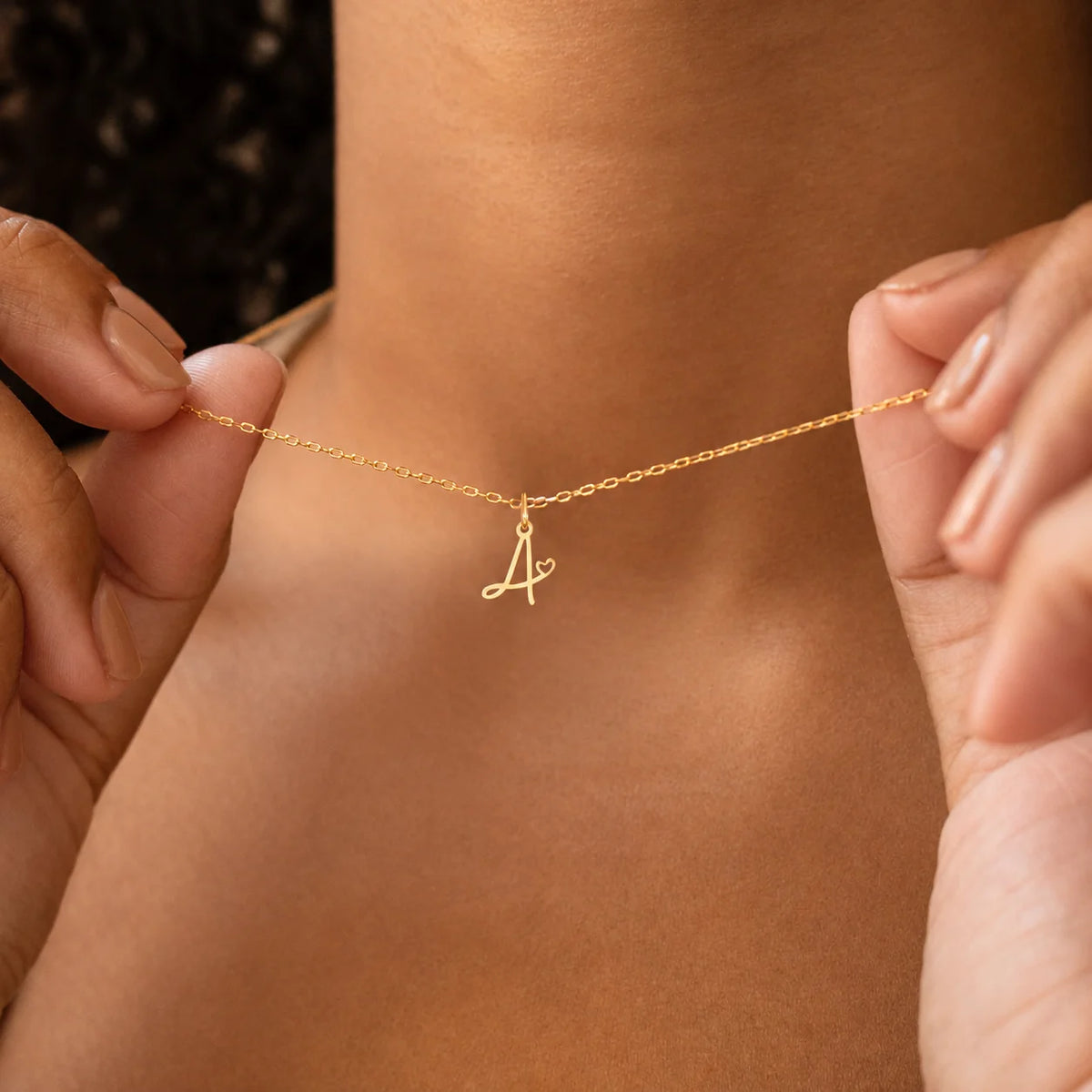 Gold plated heart initial necklace for women featuring a stainless steel A-Z letter pendant, waterproof monogram jewelry.