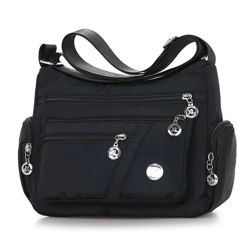 Women’s nylon waterproof messenger bag by HSF Marketplace, large capacity casual crossbody shoulder handbag for travel and daily use.