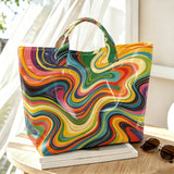 Colorful rainbow swirl marble print tote bag for women featuring psychedelic art, large capacity handbag for shopping and travel.