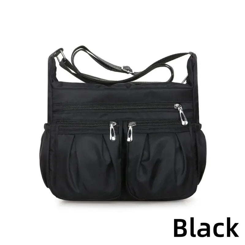 Women nylon waterproof messenger handbag with large capacity, casual crossbody style, suitable for travel and daily use.