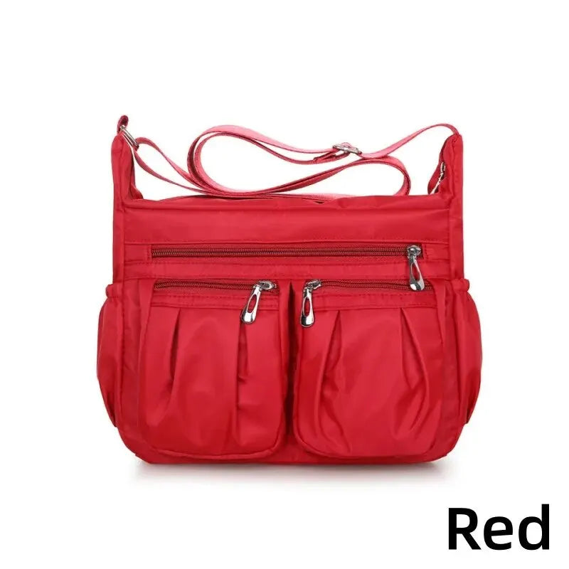 Women's nylon waterproof messenger bag by HSF Marketplace, large capacity casual crossbody shoulder handbag for travel and daily use.
