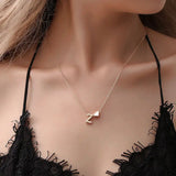 Dainty initial necklace with tiny heart pendant, gold-tone jewelry choker for women, featuring a letter pendant and delicate design.