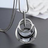 Elegant geometric crystal statement necklace with long pendant, pearls, and modern design for women, perfect for fashionable jewelry looks.