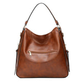 Leather hobo bag for women with spacious interior, casual shoulder style, vintage look, from HSF Marketplace, perfect for everyday use.