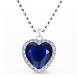 Elegant Titanic Heart of Ocean blue pendant necklace from HSF Marketplace, featuring a heart-shaped love design and velvet bag.