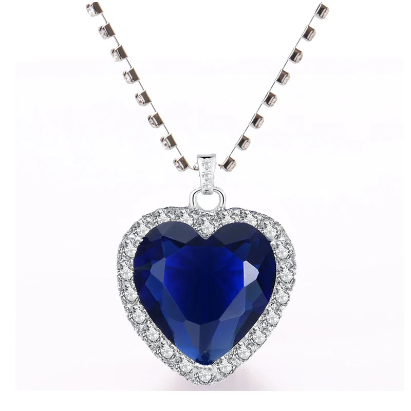 Elegant Titanic Heart of Ocean blue pendant necklace from HSF Marketplace, featuring a heart-shaped love design and velvet bag.