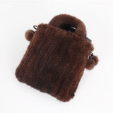 Genuine mink fur messenger shoulder handbag for women, high-quality cross-body bag with top handle, stylish and soft fur texture.