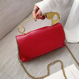 Red retro metal pin design women’s crossbody bag with chain strap, PU leather purse, clutch style handbag, stylish and compact.