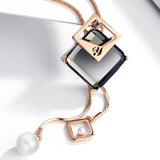 Long geometric crystal pendant necklace for women, featuring pearls and a statement design, stylish jewelry by HSF Marketplace.