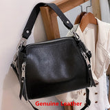 Elegant genuine leather women's messenger handbag with high capacity, crossbody style, and luxury cowhide design for travel and daily use.