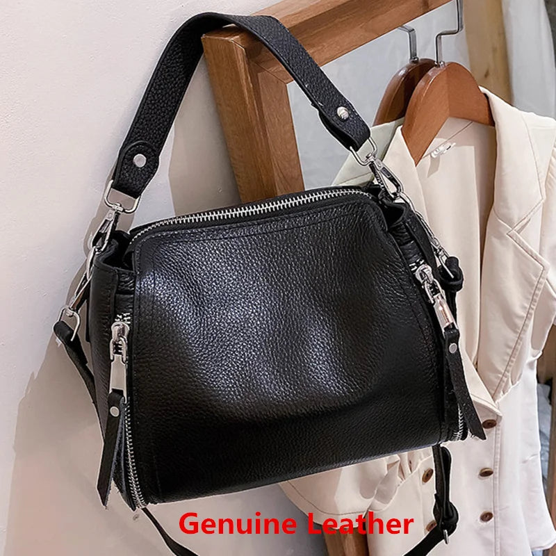 Elegant genuine leather women's messenger handbag with high capacity, crossbody style, and luxury cowhide design for travel and daily use.
