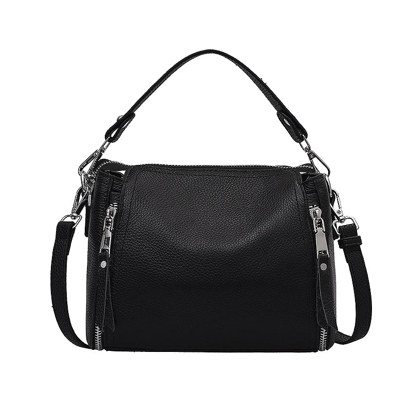 Genuine leather women's messenger handbag with high capacity, crossbody style, luxury cowhide design, and shoulder strap for travel.