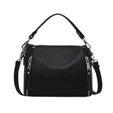 Genuine leather women's messenger handbag with high capacity, crossbody style, luxury cowhide design, and shoulder strap for travel.