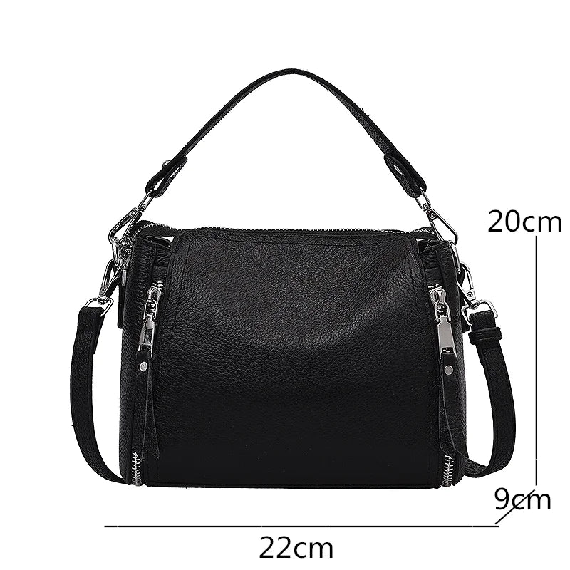Genuine leather women's messenger handbag with high capacity, cowhide design, crossbody style, and shoulder strap for travel and daily use.