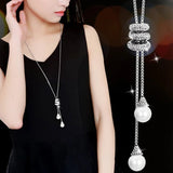 Elegant geometric crystal pendant necklace for women, featuring long pearl choker style jewelry with a statement design.
