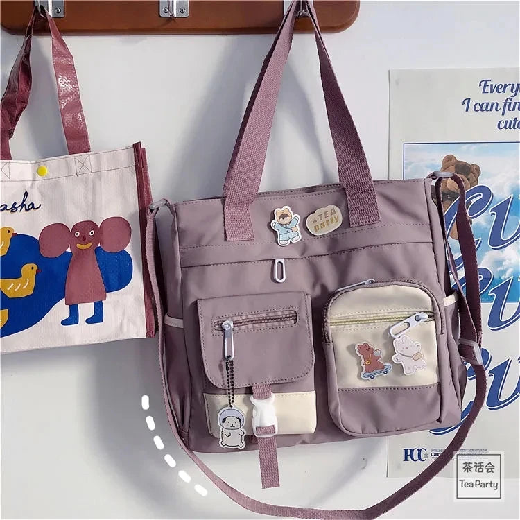 Waterproof canvas women's handbag with shoulder strap, nylon tote, and crossbody style, featuring oxford fabric and spacious satchel design.