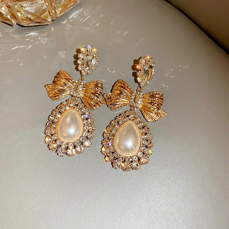 Elegant vintage gold bowknot dangle earrings for women by HSF Marketplace
