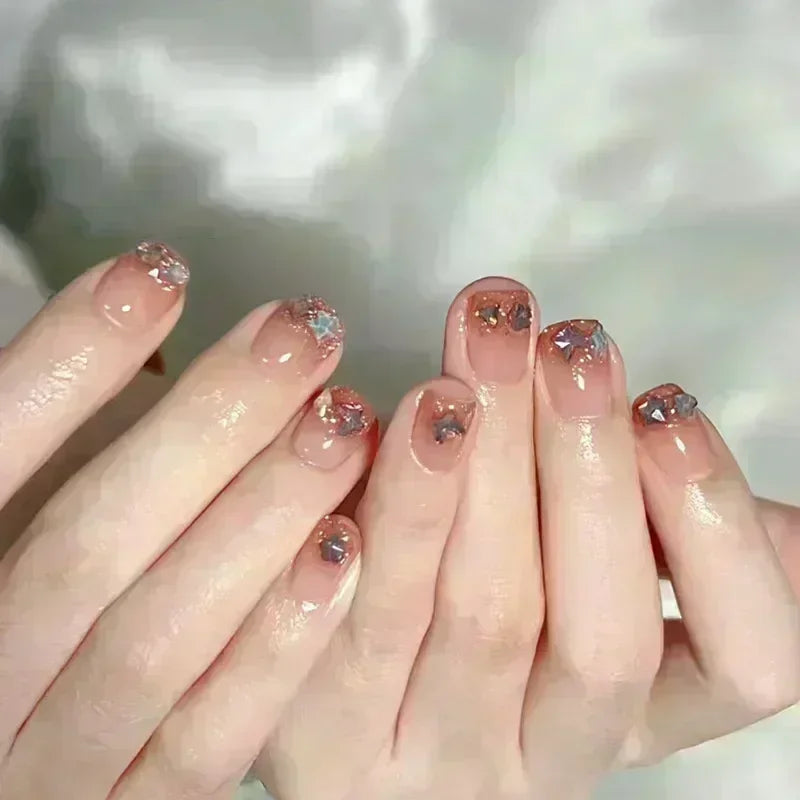 24-piece cute girly short square false nails with white French tips, glitter stars, rhinestones, cat-eye, and bows