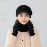 Warm knitted women’s hat, scarf, and gloves winter set in a coordinated design