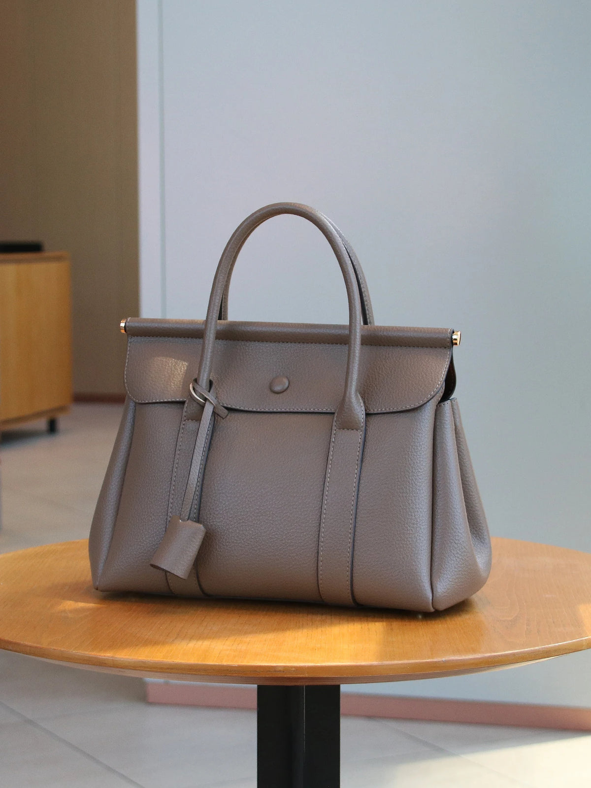 Vintage leather women's handbag with flap closure, soft high-quality leather shoulder bag for office and commute.