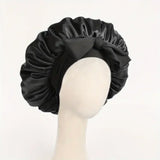 Silk satin bonnet with adjustable tie band for women and men, designed for hair protection and styling during sleep.