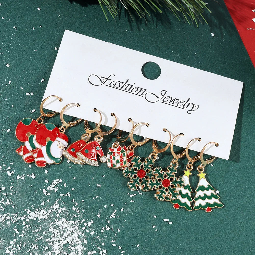 Festive Christmas dangle earrings by HSF Marketplace featuring snowman and elk charms