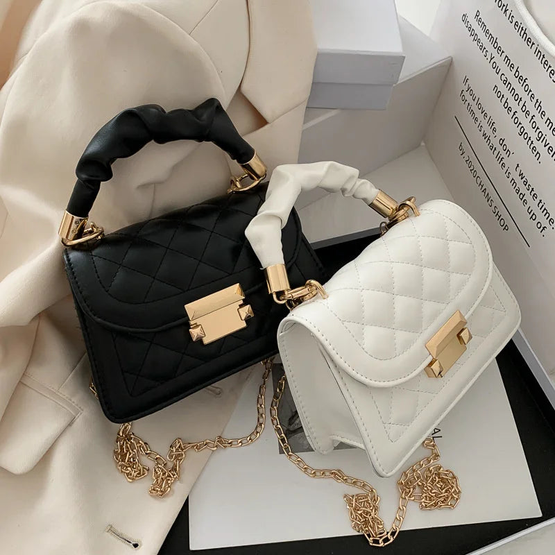 Luxury black PU leather shoulder handbag for women, small underarm purse with elegant design and compact size.