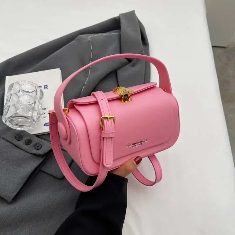 Classic black women's shoulder bag with textured leather, square shape, flap closure, and large capacity for versatile use.