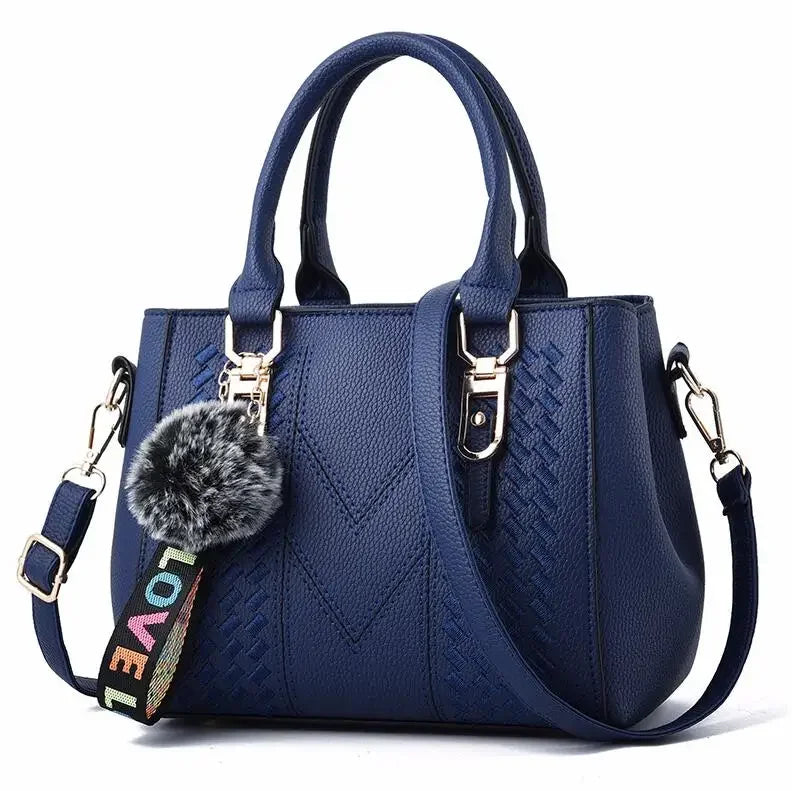 Leather embroidery messenger handbag for women with hairball design, stylish leather purse from HSF Marketplace.