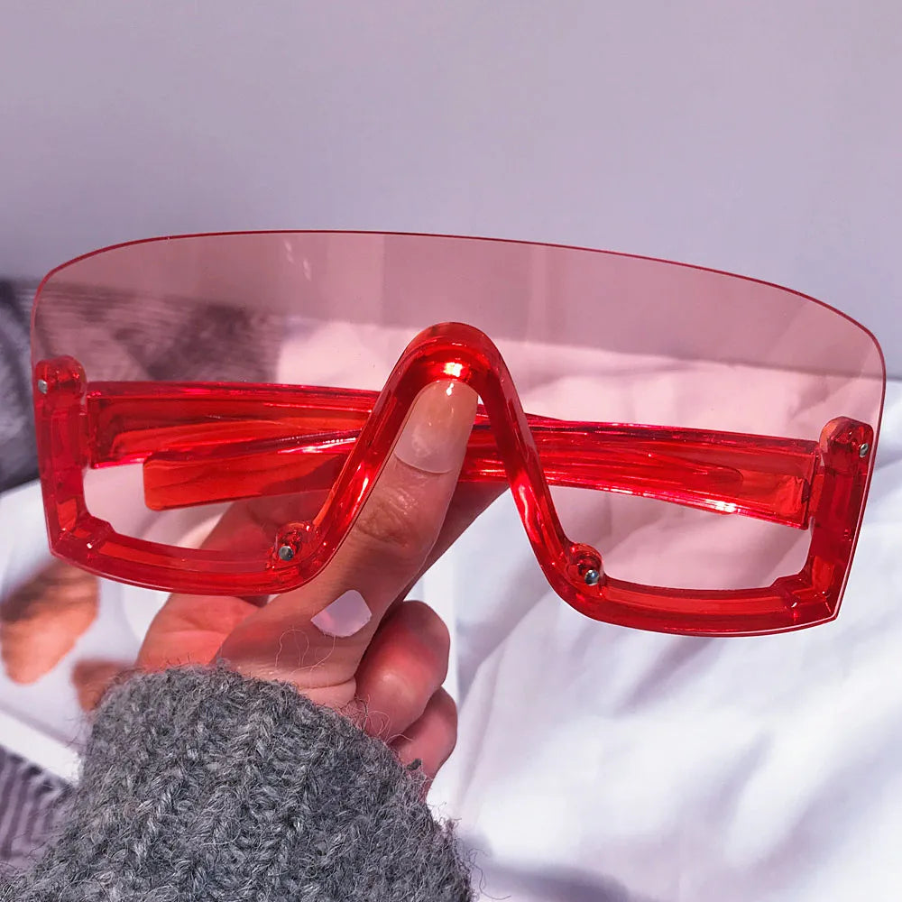 Candy color oversized sunglasses with red and yellow shield design for women, trendy fashion hip hop sun shades.