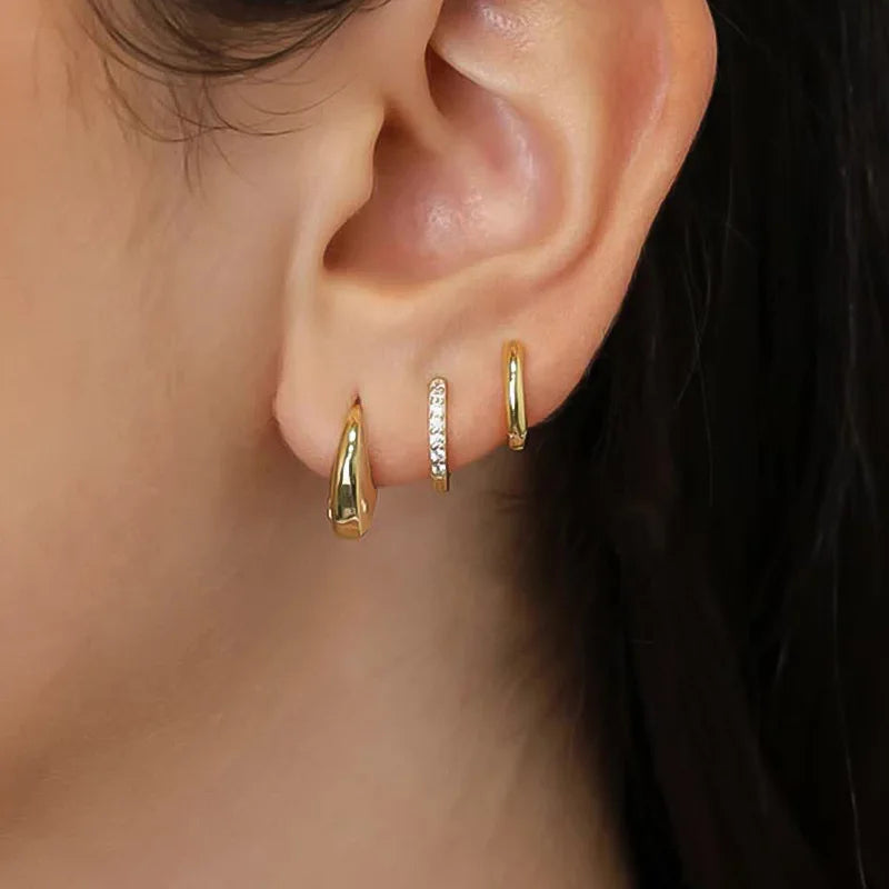 Three pairs of gold-plated stainless steel crystal zirconia hoop earrings for women with simple circle design