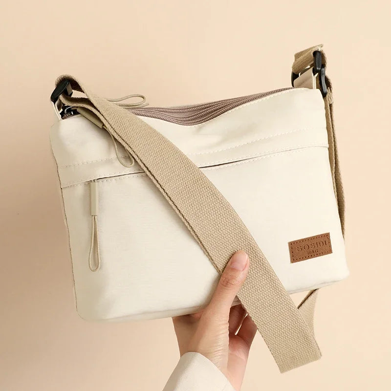High-capacity HSF Marketplace women's shoulder crossbody bag with three main pockets, canvas design, ideal for shopping and daily use