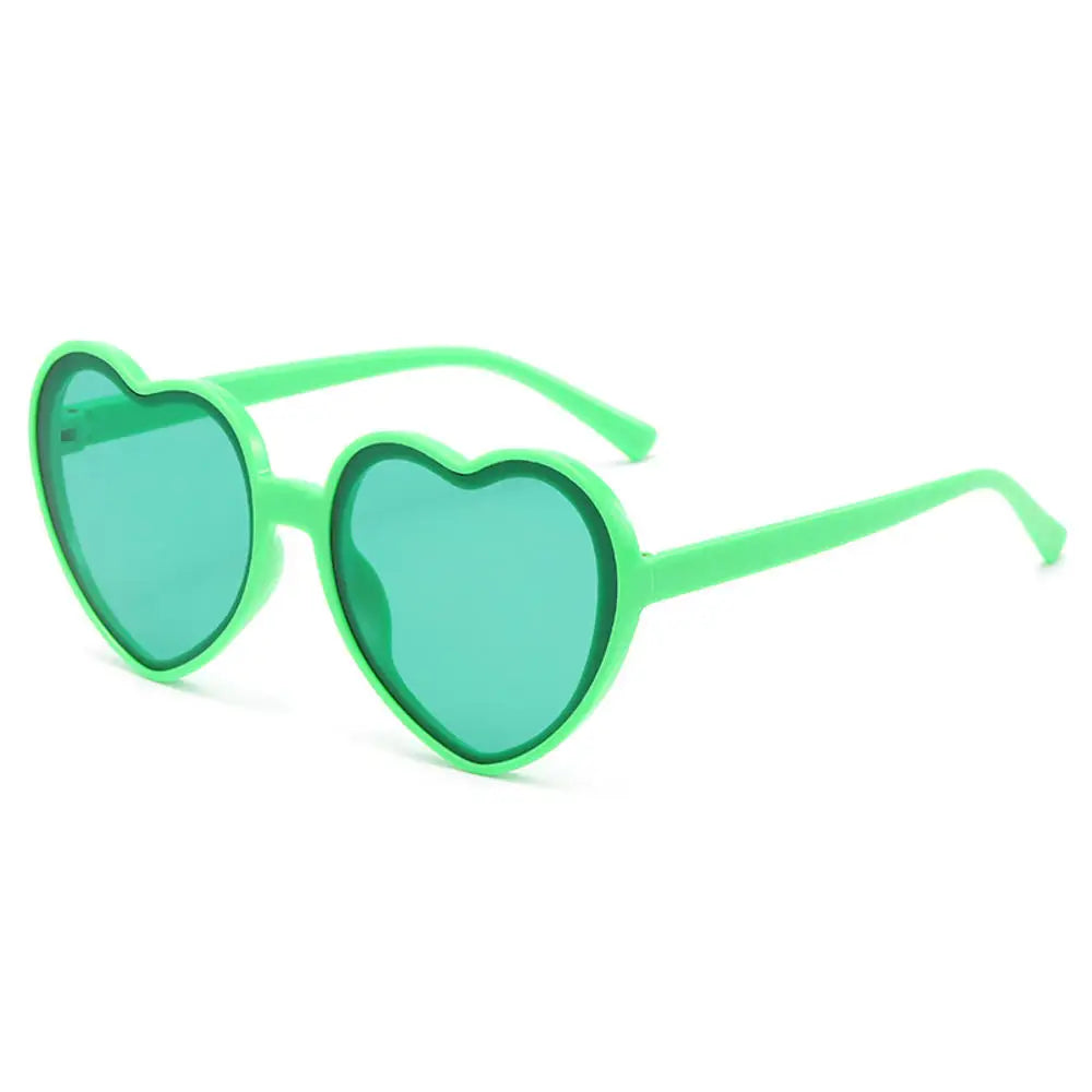 Pink love heart-shaped sunglasses for women with big vintage frames, UV400 protection, stylish outdoor cute eyewear.