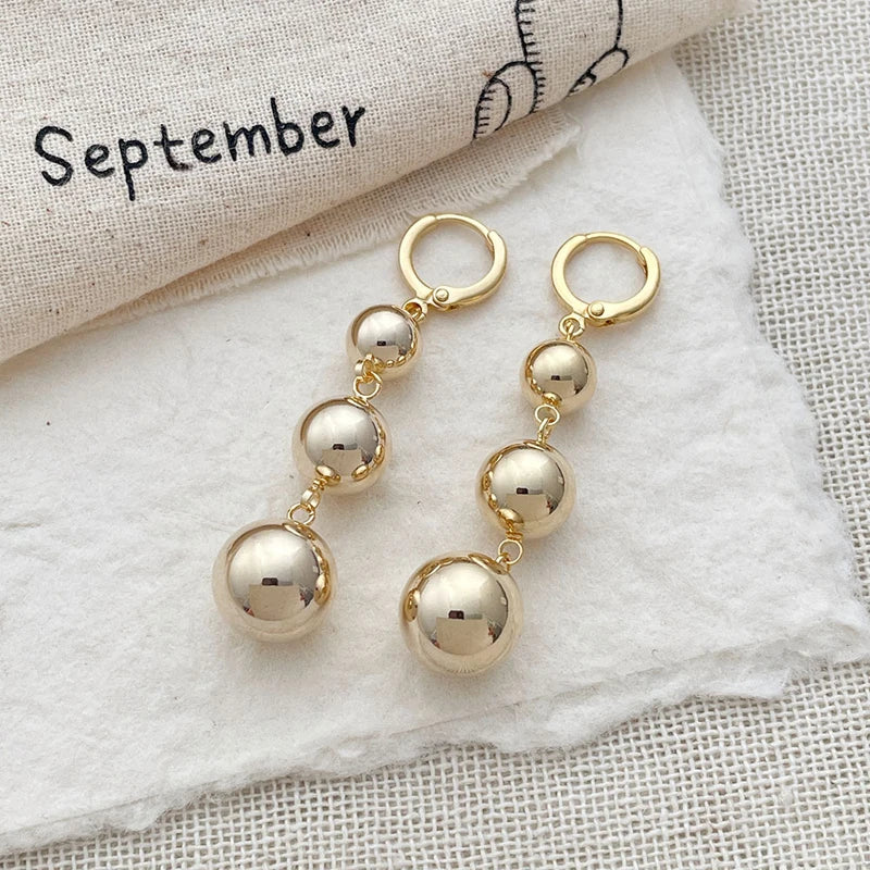 Gold color punk metal round bead tassel pendant earrings with glossy smooth ball details for women, HSF Marketplace
