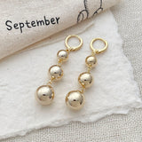 Gold color punk metal round bead tassel pendant earrings with glossy smooth ball details for women, HSF Marketplace