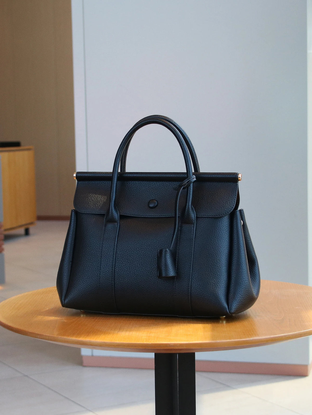 Elegant vintage women's handbag by HSF Marketplace featuring a soft leather flap messenger style shoulder bag for office and commute.