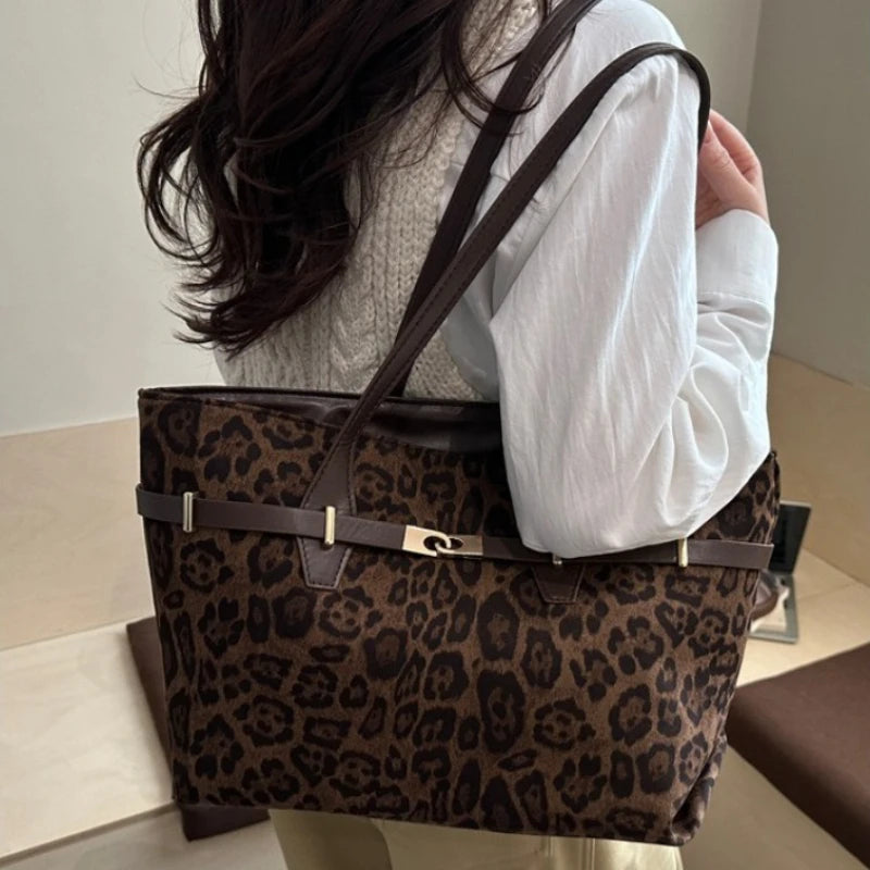 Leopard print shoulder tote bag with brown faux leather trim, gold lock detail, spacious handbag for women’s work and daily use.