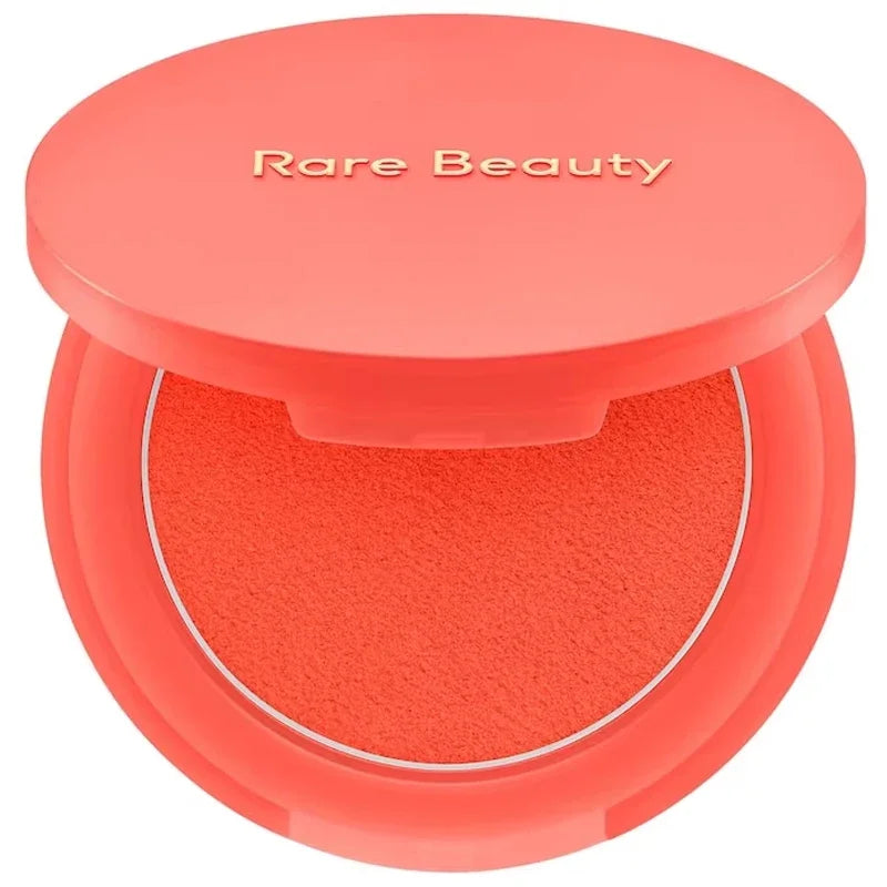 Rare Beauty moisturizing matte lipstick and natural powder blusher from HSF Marketplace, featuring portable makeup products with a smooth finish.