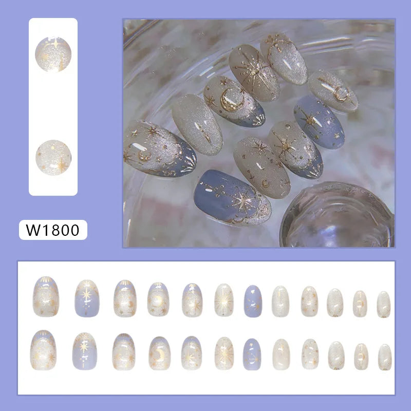 24-piece Y2K star press-on false nails with gradient blue French tips and gold moon designs, almond shape