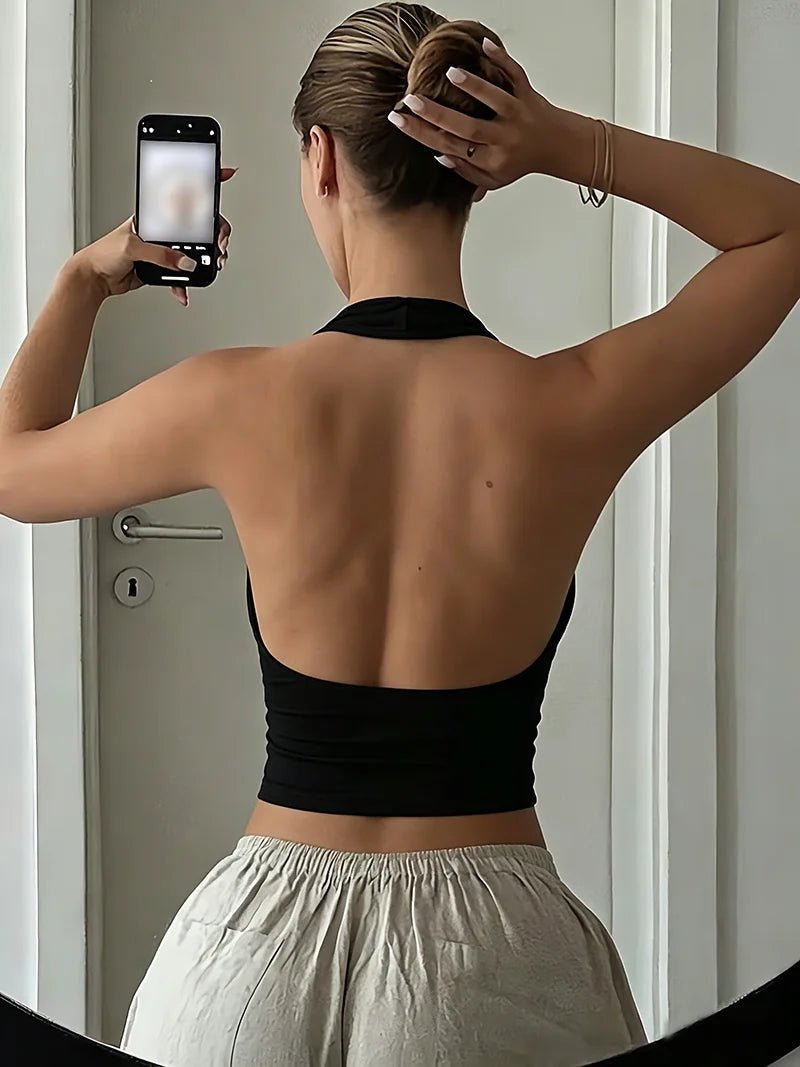 Women's solid color sleeveless backless vest top with hanging neck, casual elegant summer style by HSF Marketplace.