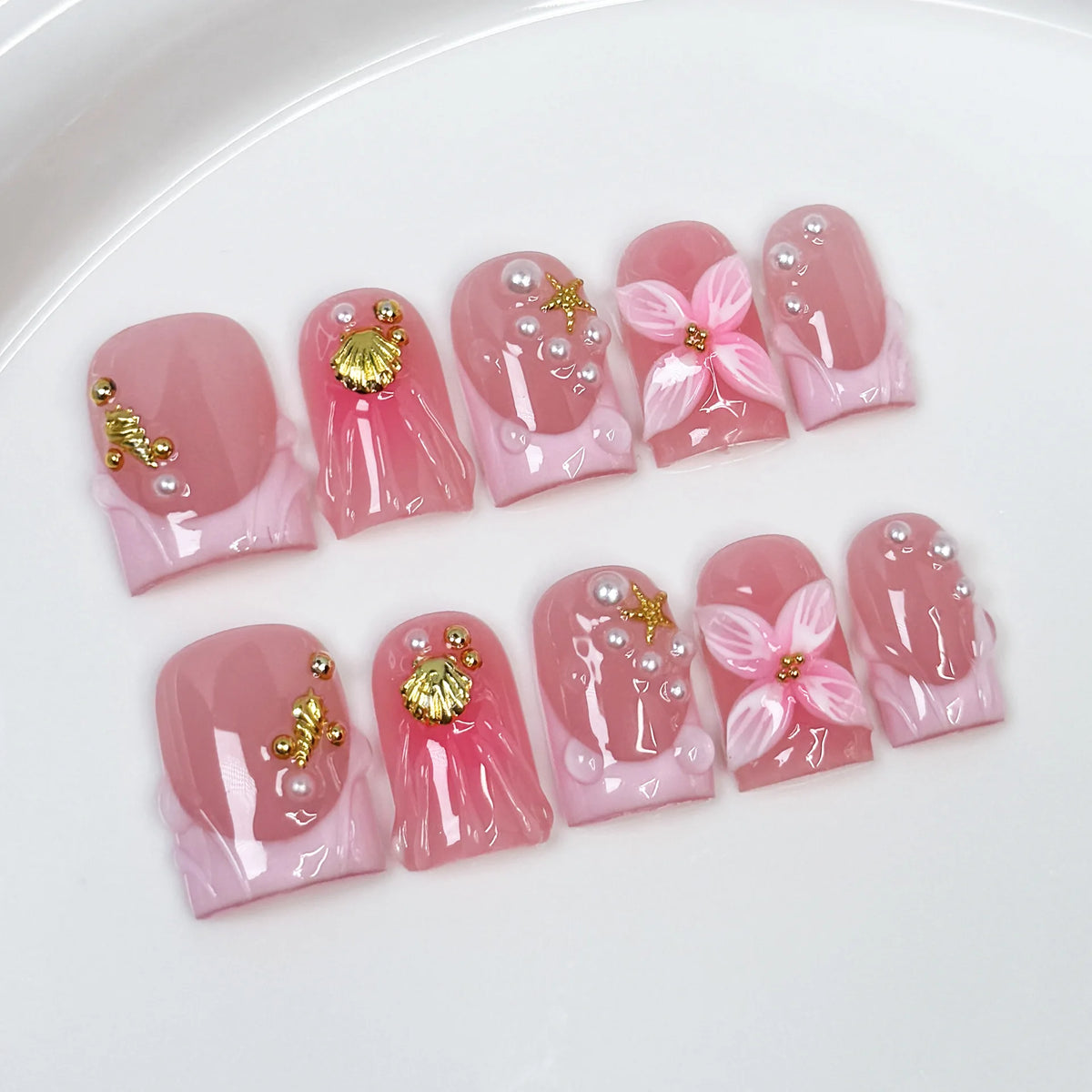 10-piece short duck bill press-on false nails with pink French tips, 3D butterfly flowers, pearls, hearts, and rhinestones