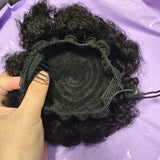 Kinky curly human hair drawstring ponytail bun with Brazilian clip-in extensions in natural curls