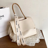 Large capacity women's tote handbag in high-quality PU leather with shoulder strap, stylish designer handbag for ladies.