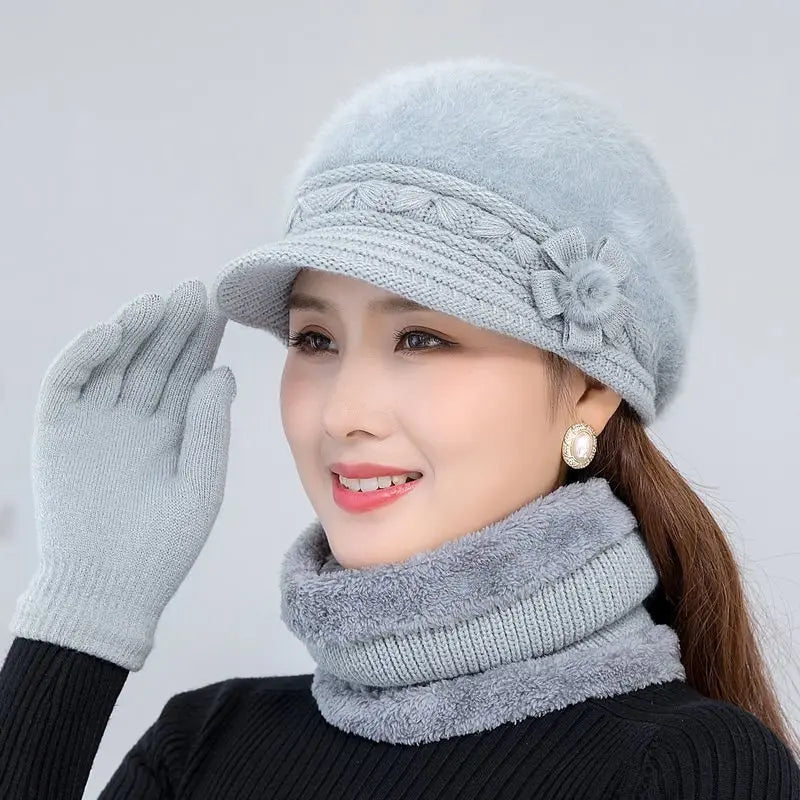 Warm knitted women’s winter hat, scarf, and gloves set in a coordinated design for cold-weather comfort