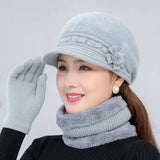 Warm knitted women’s winter hat, scarf, and gloves set in a coordinated design for cold-weather comfort